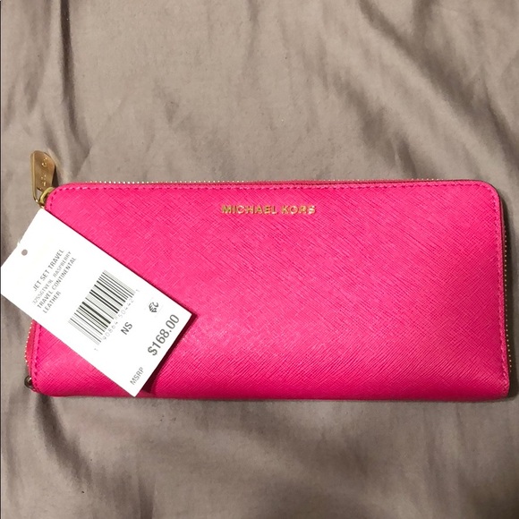 Michael Kors Handbags - Michael Kors Jet Set Travel Rasberry wallet